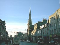 A newly rebuilt church spire and afternoon sun.